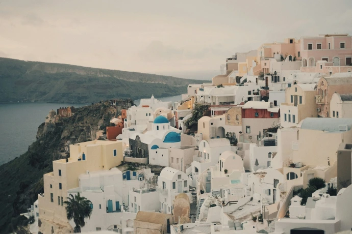 white and brown concrete houses on hill during daytime